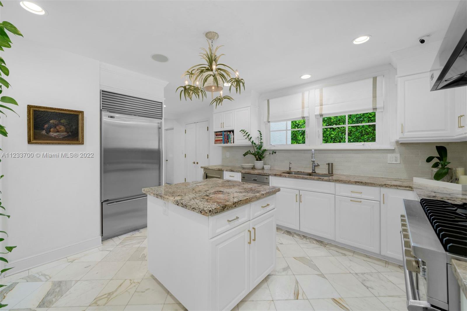 3618 St Gaudens Road Miami, FL 33133 - Photo 14 of 38 a kitchen with a white stove top oven and refrigerator