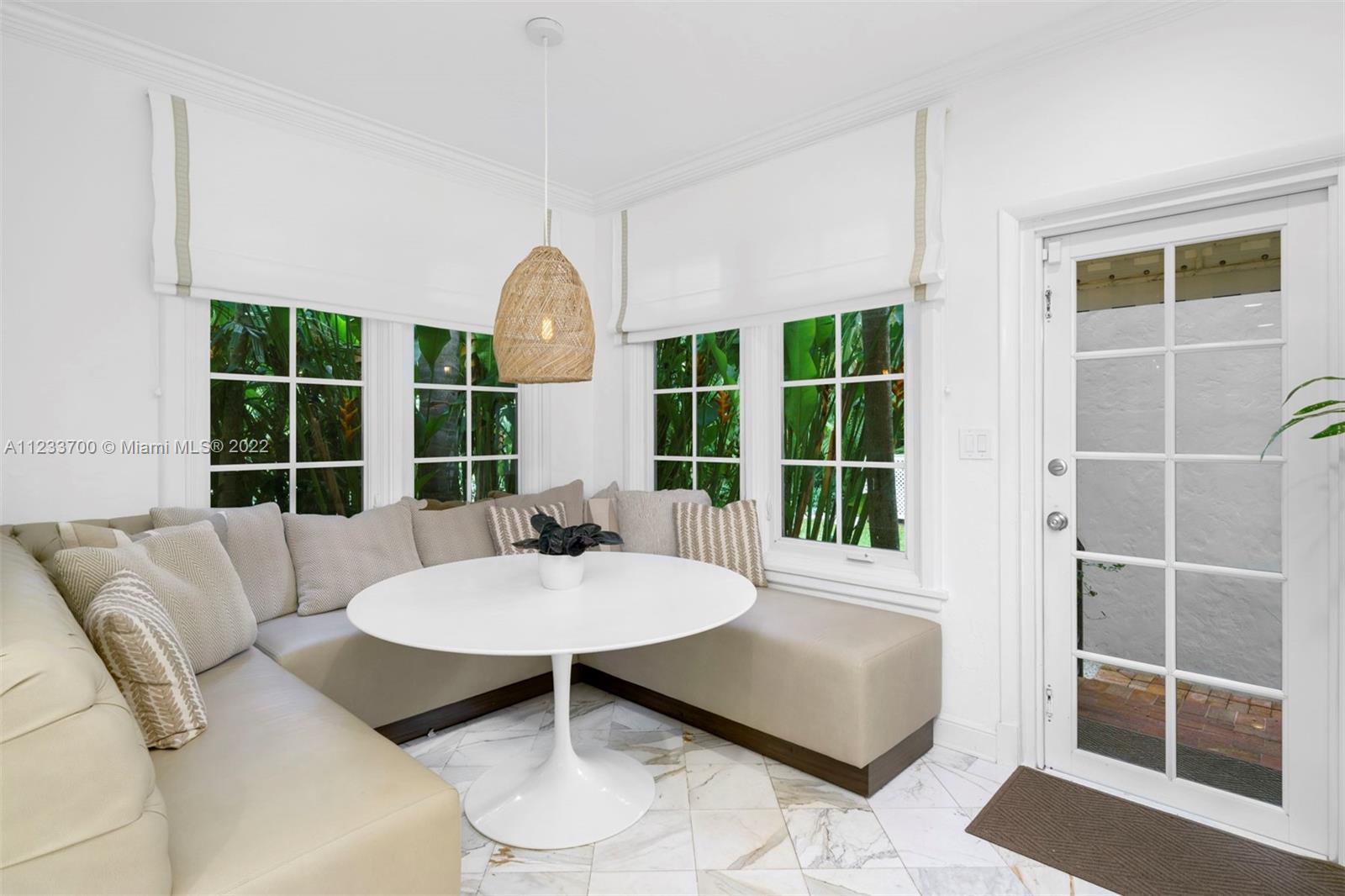 3618 St Gaudens Road Miami, FL 33133 - Photo 15 of 38 a living room with furniture and a large window