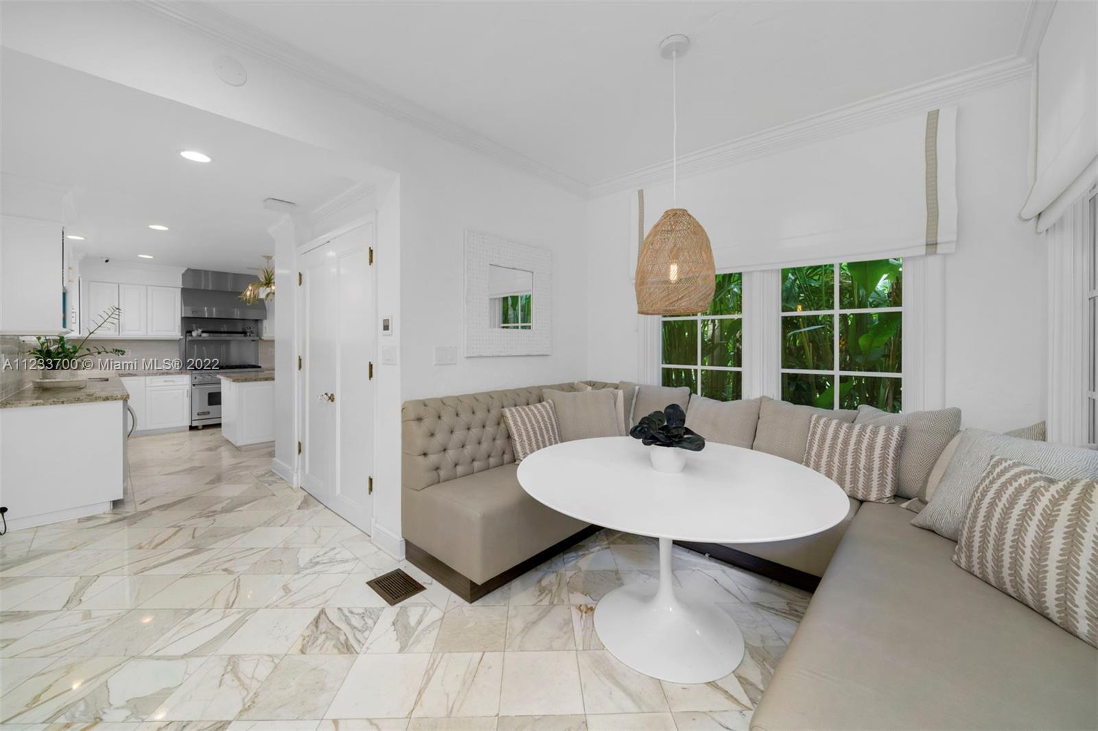 3618 St Gaudens Road Miami, FL 33133 - Photo 16 of 38 a living room with furniture and a large window