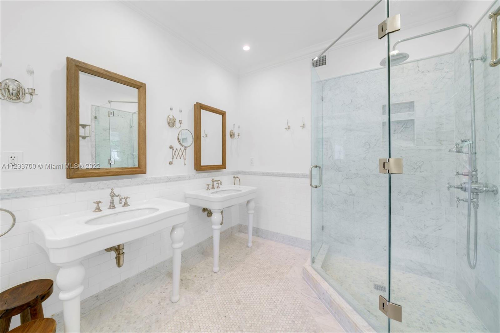 3618 St Gaudens Road Miami, FL 33133 - Photo 23 of 38 a bathroom with a sink mirror and a shower