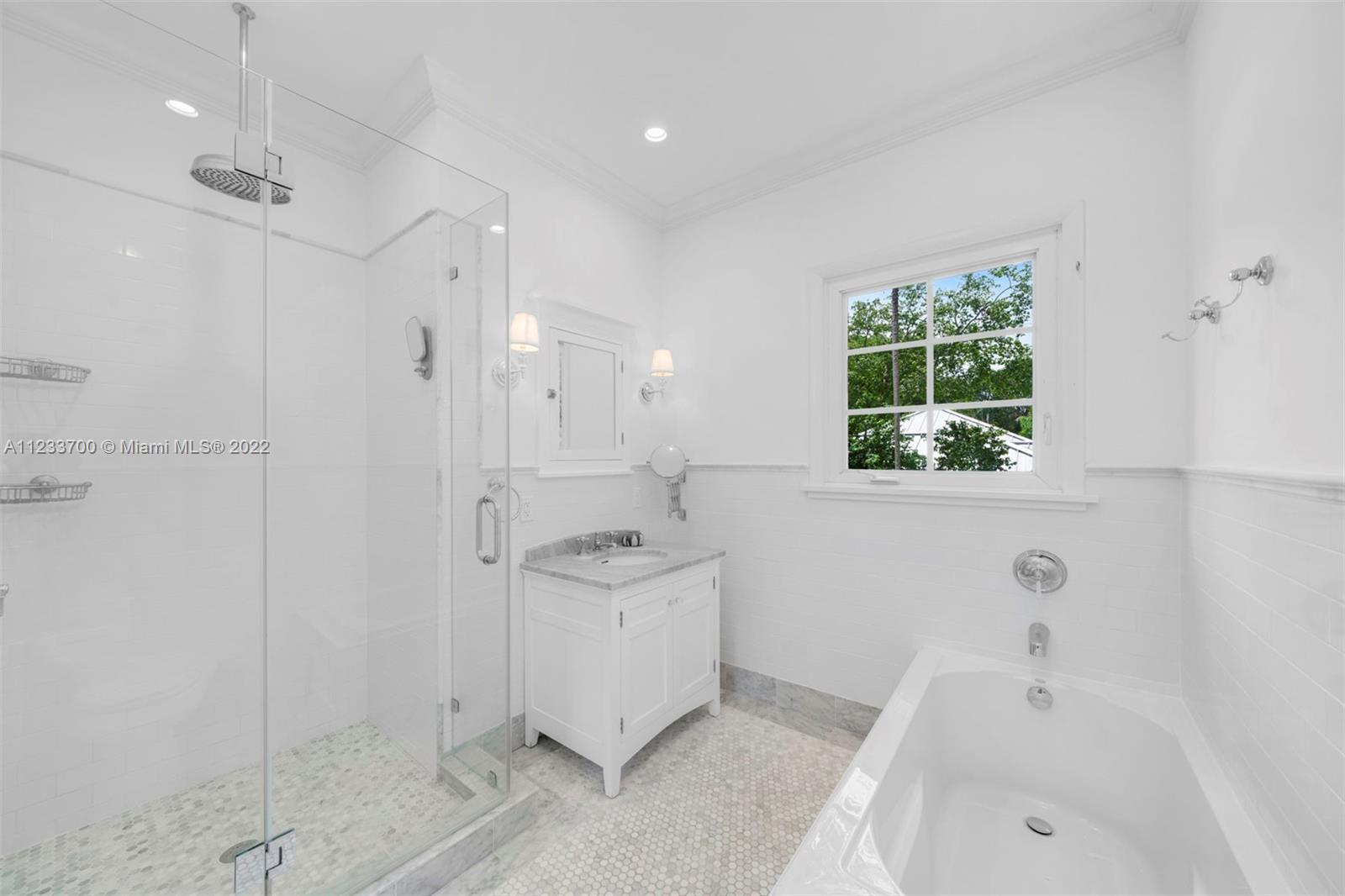 3618 St Gaudens Road Miami, FL 33133 - Photo 25 of 38 a bathroom with a sink a toilet and shower