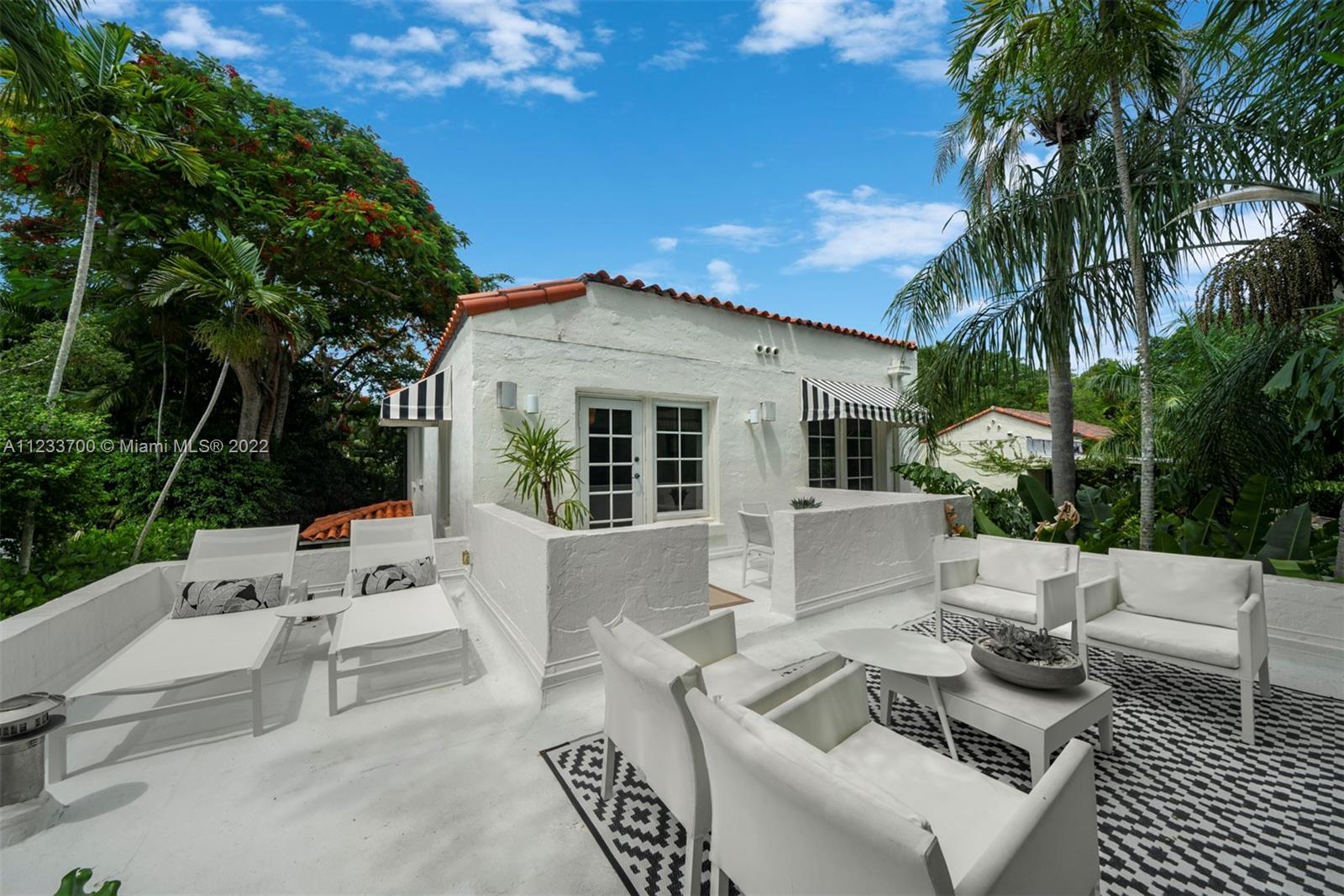 3618 St Gaudens Road Miami, FL 33133 - Photo 27 of 38 a front view of a house with garden