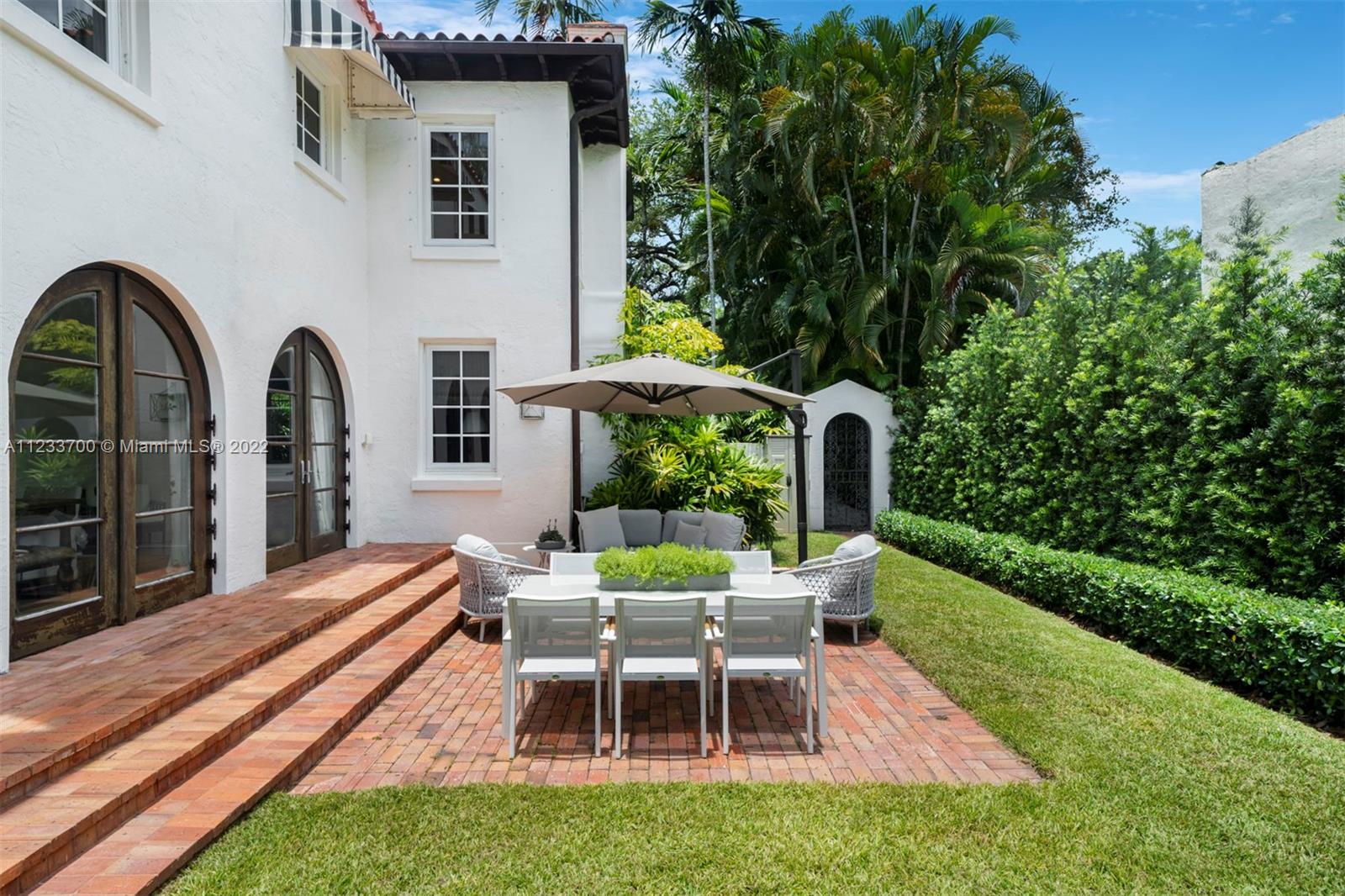 3618 St Gaudens Road Miami, FL 33133 - Photo 30 of 38 a view of a house with backyard porch and sitting area