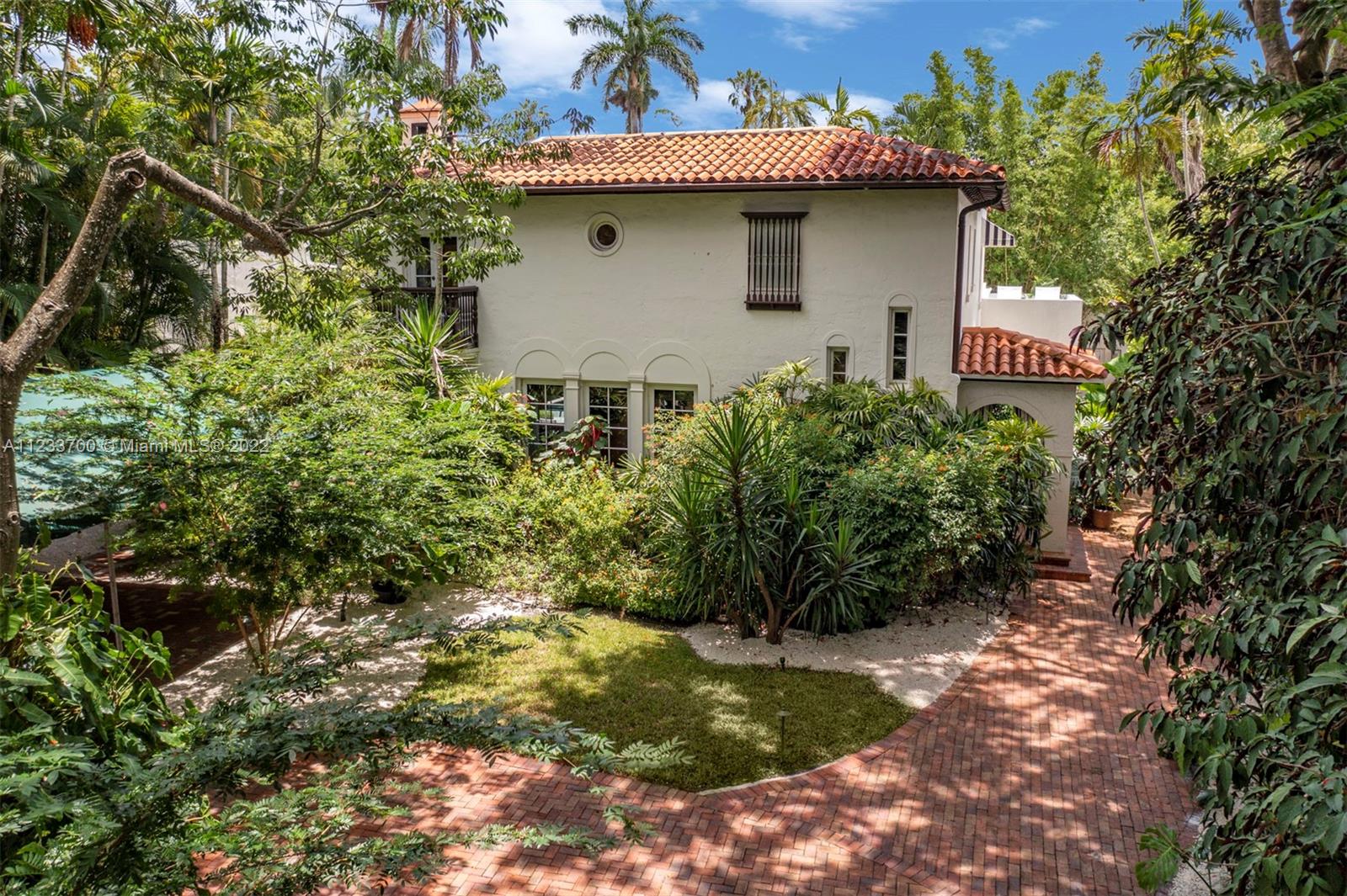 3618 St Gaudens Road Miami, FL 33133 - Photo 3 of 38 a front view of a house with a yard
