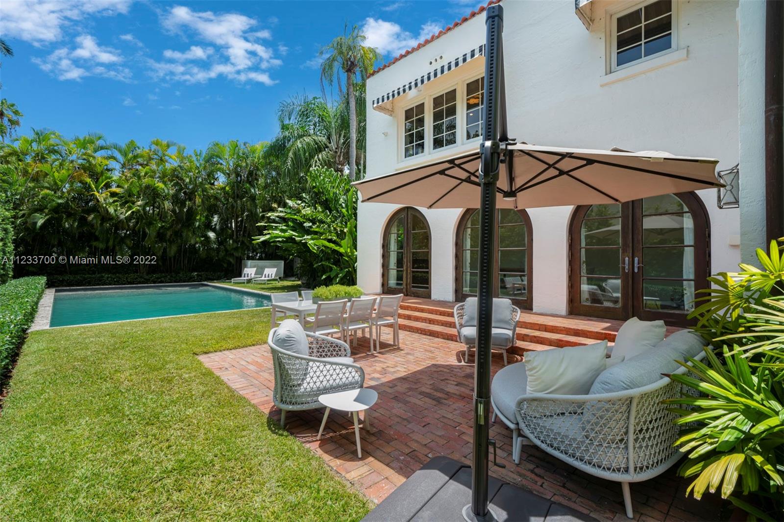 3618 St Gaudens Road Miami, FL 33133 - Photo 31 of 38 a view of a house with backyard and porch