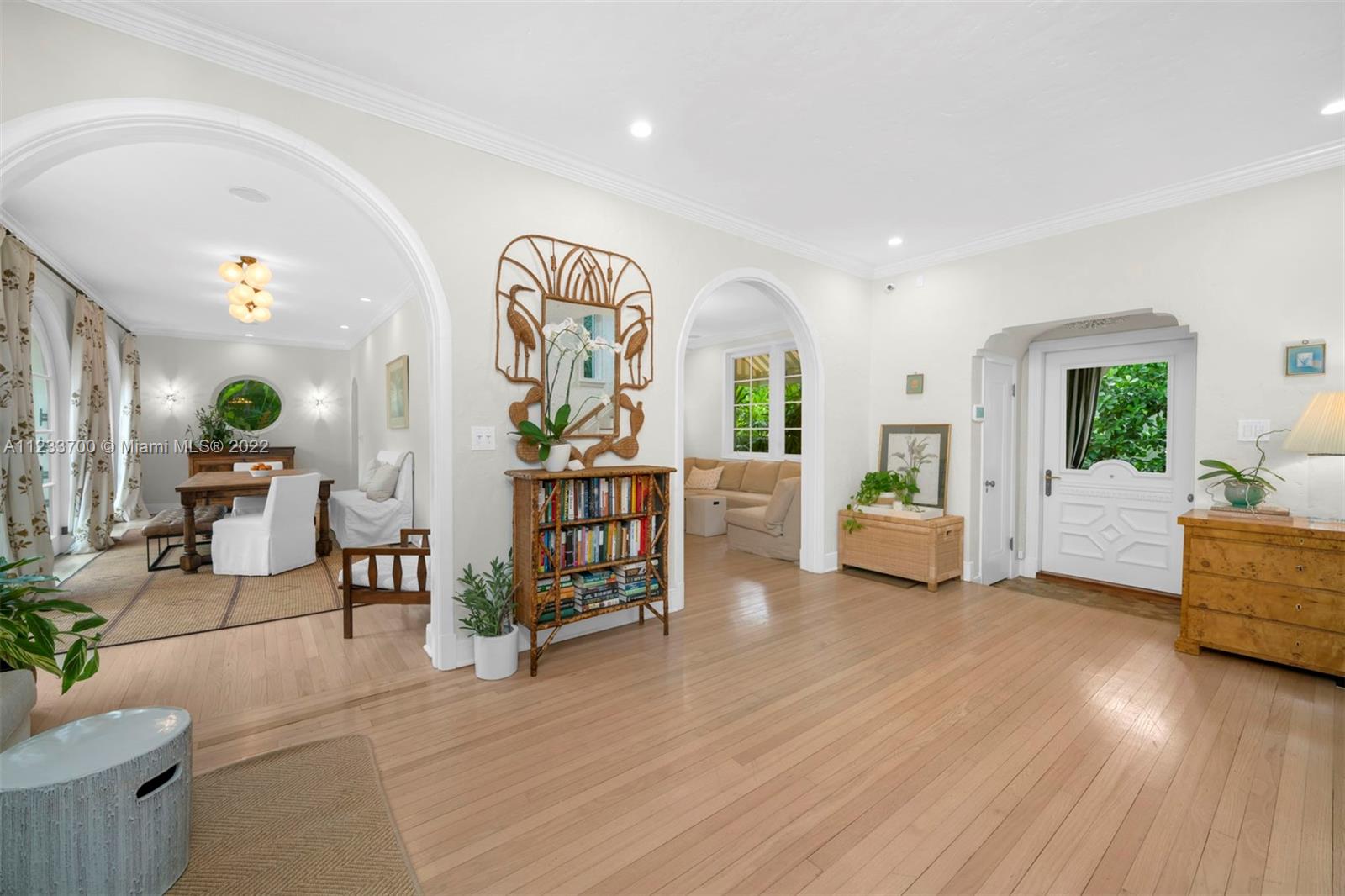 3618 St Gaudens Road Miami, FL 33133 - Photo 8 of 38 a living room with furniture and wooden floor