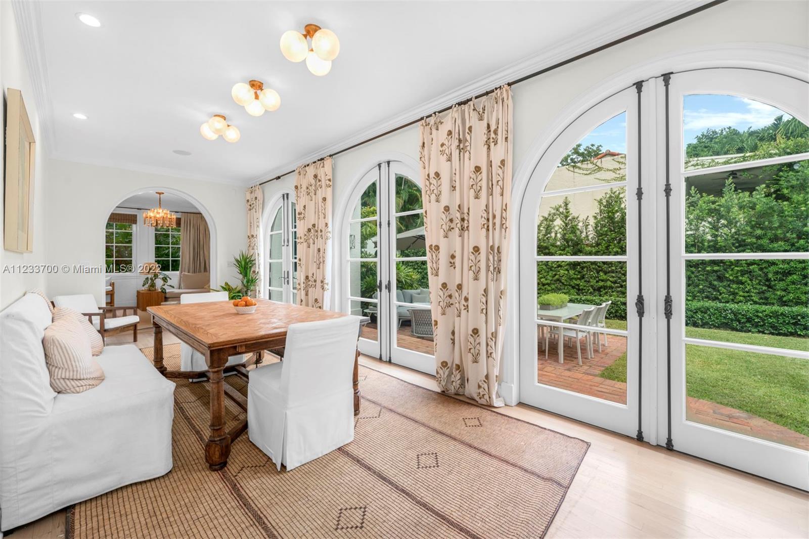3618 St Gaudens Road Miami, FL 33133 - Photo 9 of 38 a dining room with large window