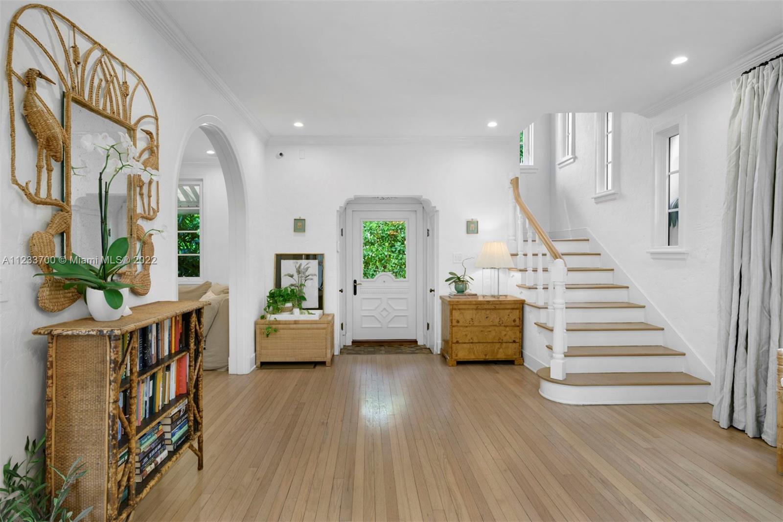 3618 St Gaudens Road Miami, FL 33133 - Photo 10 of 38 a living room with fireplace furniture and a wooden floor