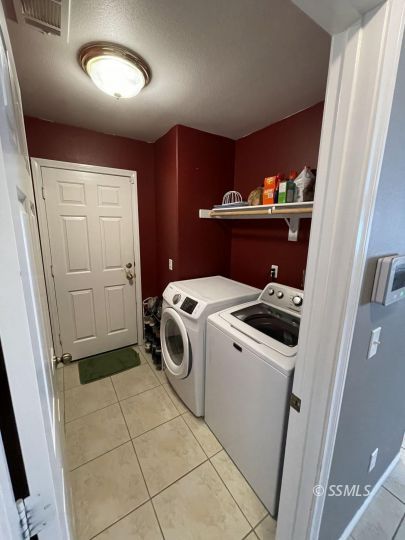 1411 Sims Street Ridgecrest, CA 93555 - Photo 28 of 35 a utility room with dryer and washer