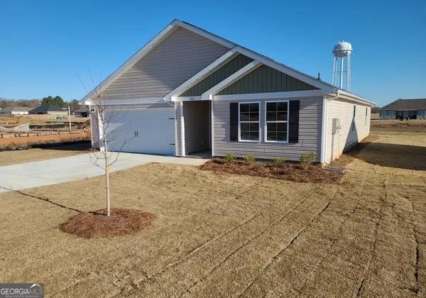 a front view of a house with a garage