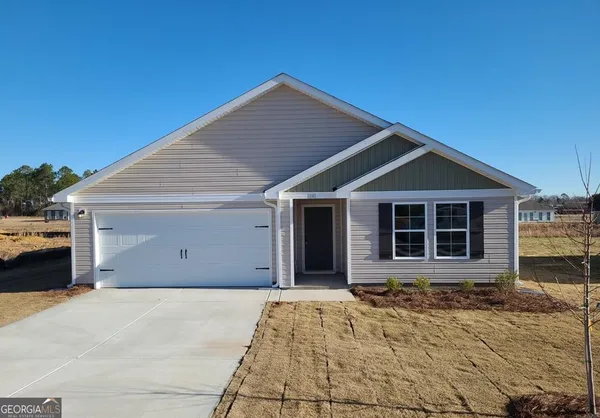 a front view of a house with a yard