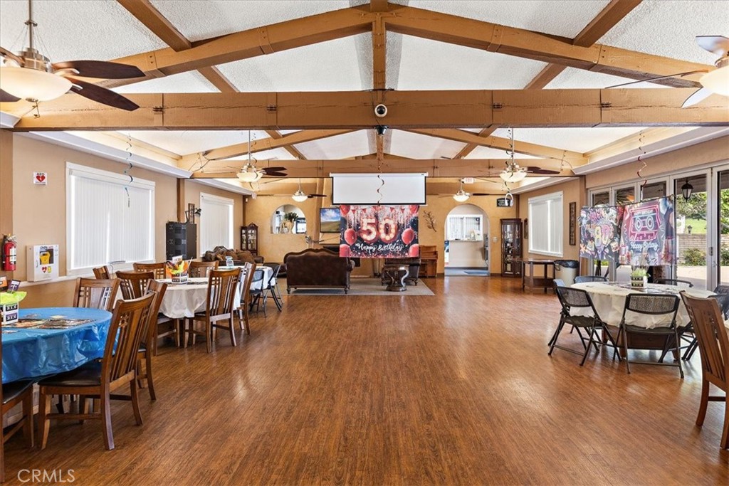 1001 West Lambert Road, Unit 110 La Habra, CA 90631 - Photo 33 of 39 a view of a dining room with furniture window and wooden floor