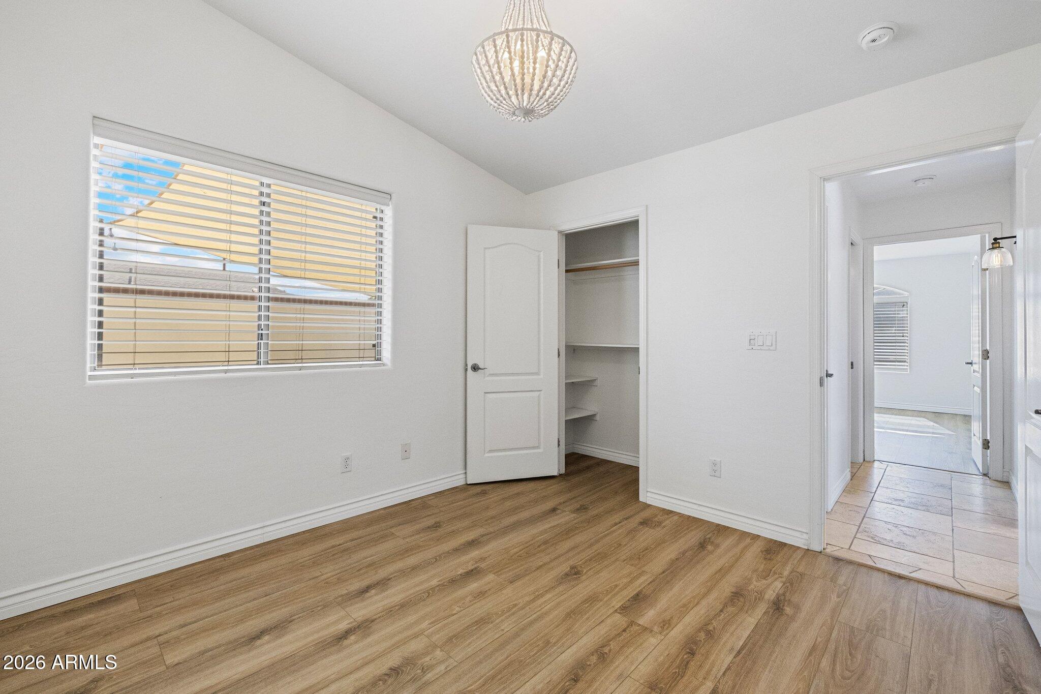5233 North 15th Street Phoenix, AZ 85014 - Photo 16 of 26 a view of empty room with wooden floor