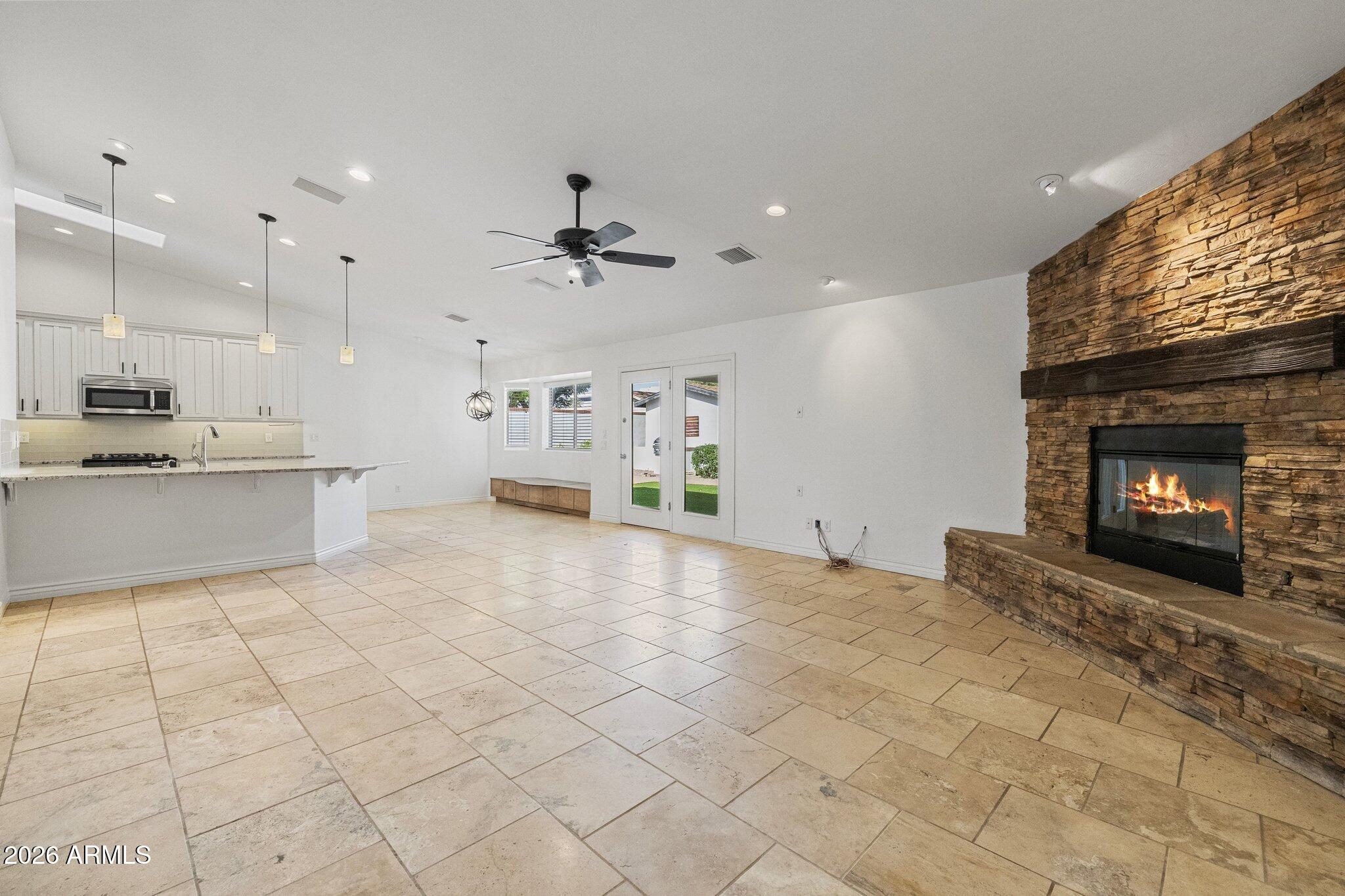 5233 North 15th Street Phoenix, AZ 85014 - Photo 4 of 26 a view of a kitchen with furniture and a fireplace