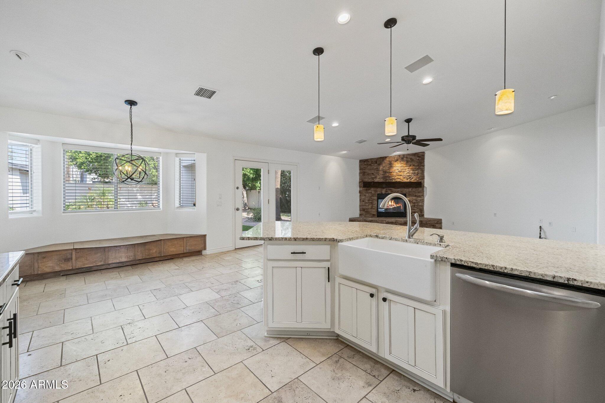 5233 North 15th Street Phoenix, AZ 85014 - Photo 7 of 26 a kitchen with a sink a counter space appliances and cabinets