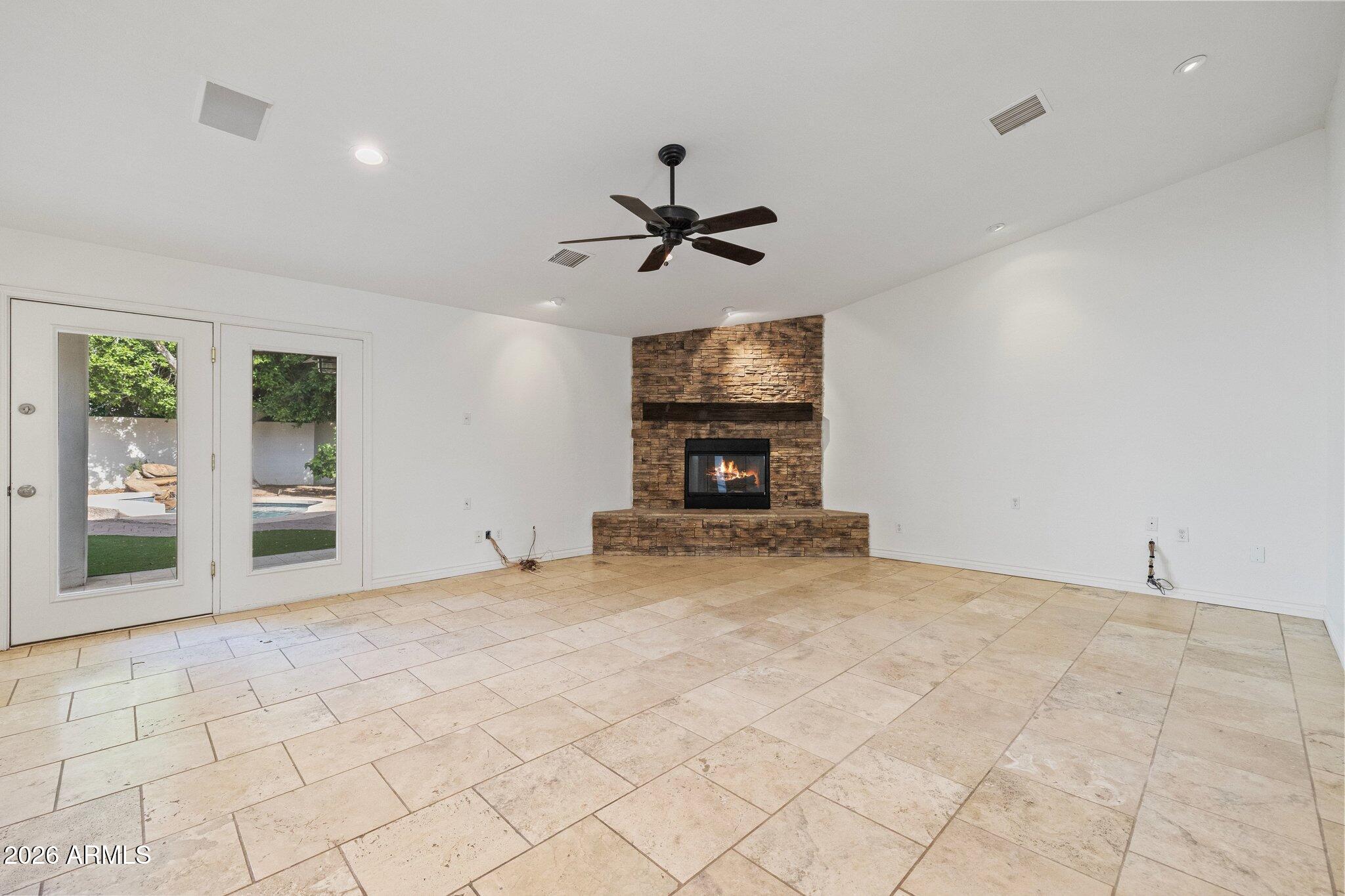5233 North 15th Street Phoenix, AZ 85014 - Photo 10 of 26 a view of a livingroom with a fireplace and a chandelier