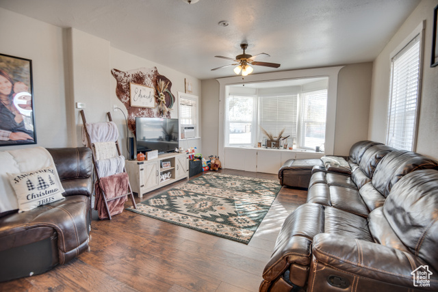 410 North Main Street Beaver, UT 84713 - Photo 17 of 31 Living room with dark hardwood / wood-style flooring and ceiling fan