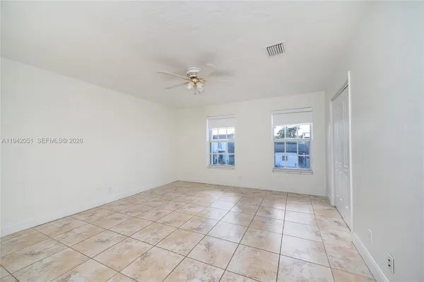 a view of an empty room with a window