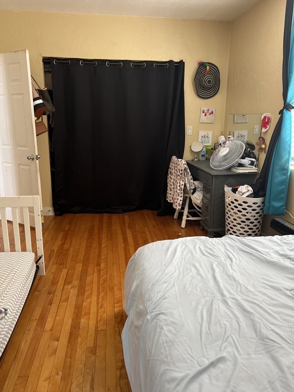 17 Federal Street, Unit 606 Worcester, MA 01608 - Photo 11 of 24 a bedroom with a bed and utility room