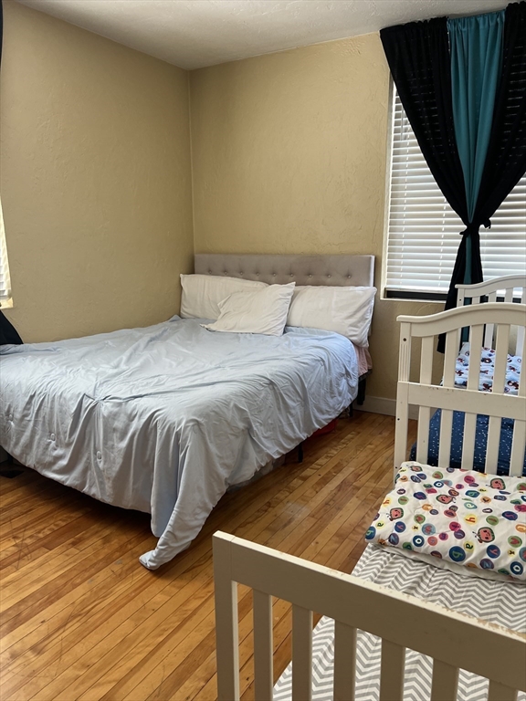 17 Federal Street, Unit 606 Worcester, MA 01608 - Photo 12 of 24 a bedroom with double bed and a window