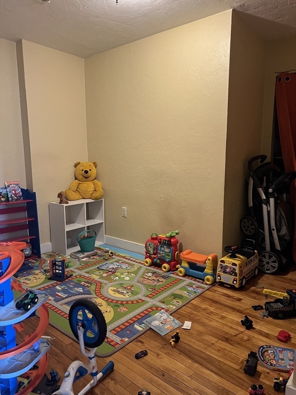 17 Federal Street, Unit 606 Worcester, MA 01608 - Photo 14 of 24 a room with furniture and gym equipment