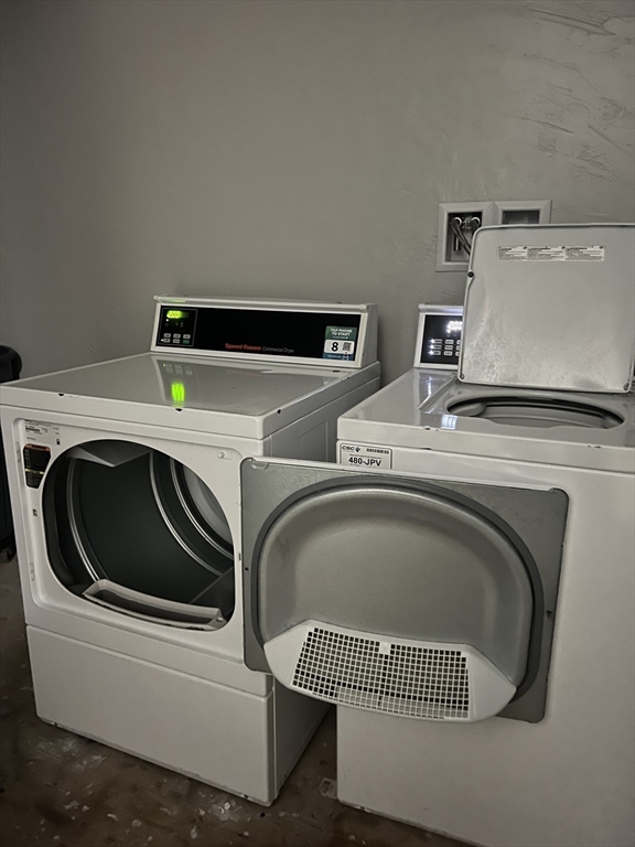 17 Federal Street, Unit 606 Worcester, MA 01608 - Photo 19 of 24 a utility room with dryer and washer