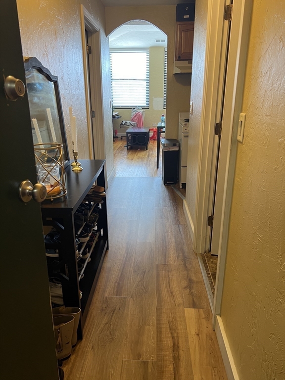 17 Federal Street, Unit 606 Worcester, MA 01608 - Photo 4 of 24 a view of a room with wooden floor and furniture