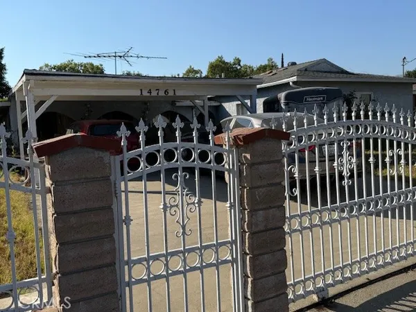 a view of a car park with an outdoor seating