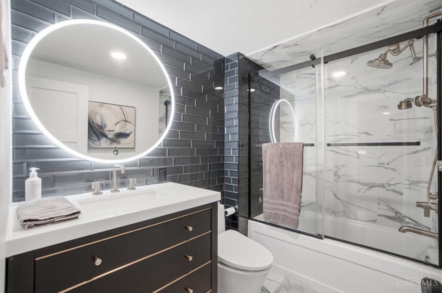 2324 Madison Road, Unit 303 Cincinnati, OH 45208 - Photo 19 of 33 Primary bathroom features include: extra deep soaking tub, LED accent vanity mirror, Brizo shower with adjustable head and hand held washer.