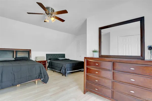 a bedroom with a bed and a closet