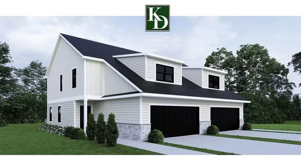 a front view of a house with garage