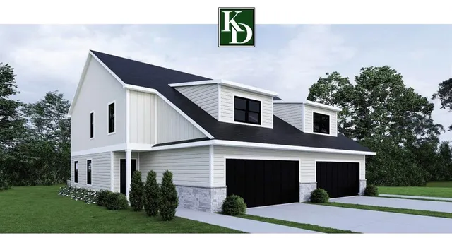 a front view of a house with garage