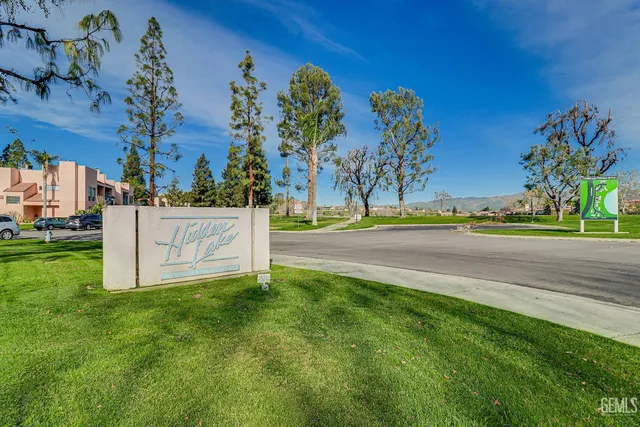 a view of a park with large trees