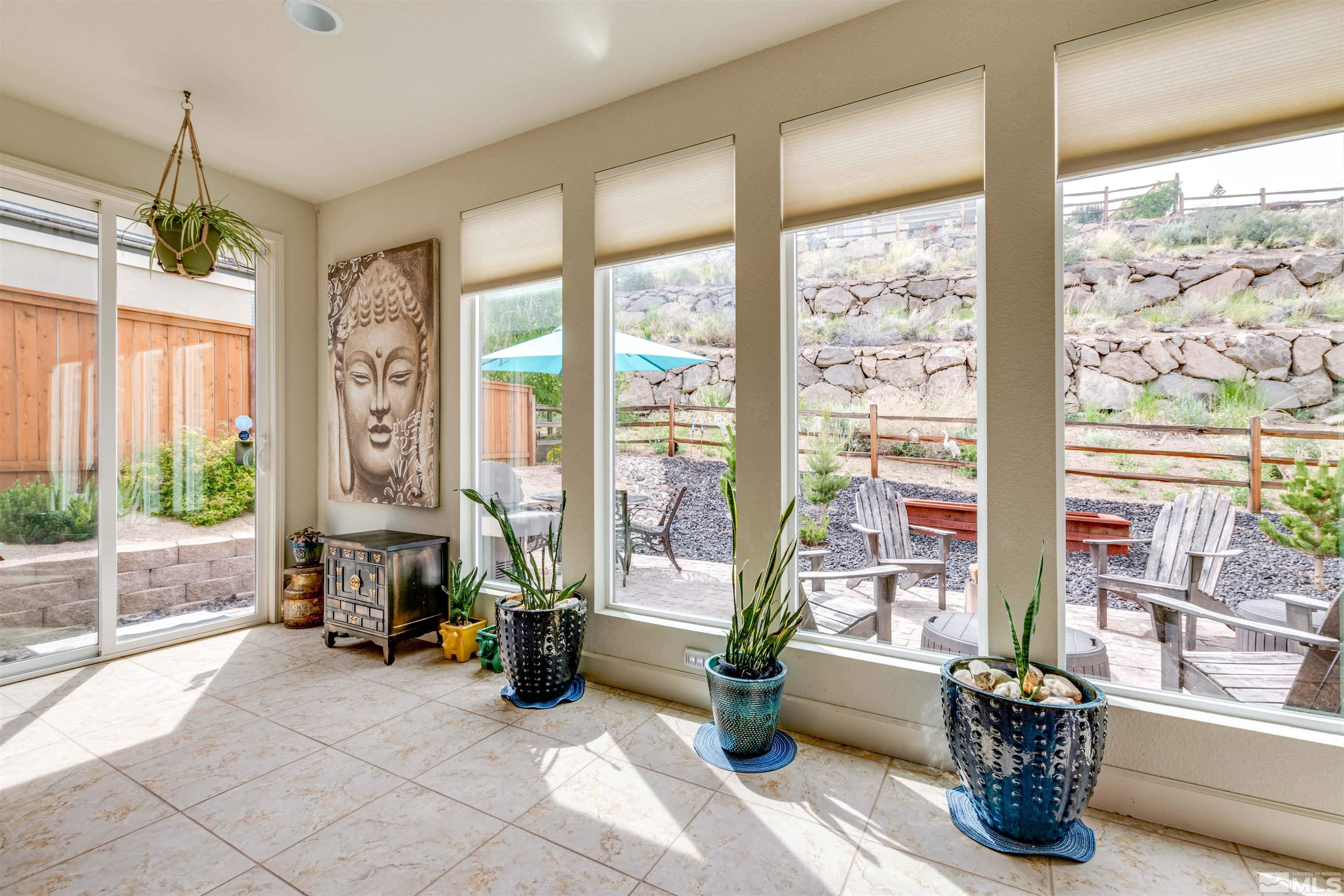 1180 Wakefield Trail Reno, NV 89523 - Photo 11 of 21 a living room with furniture and floor to ceiling windows