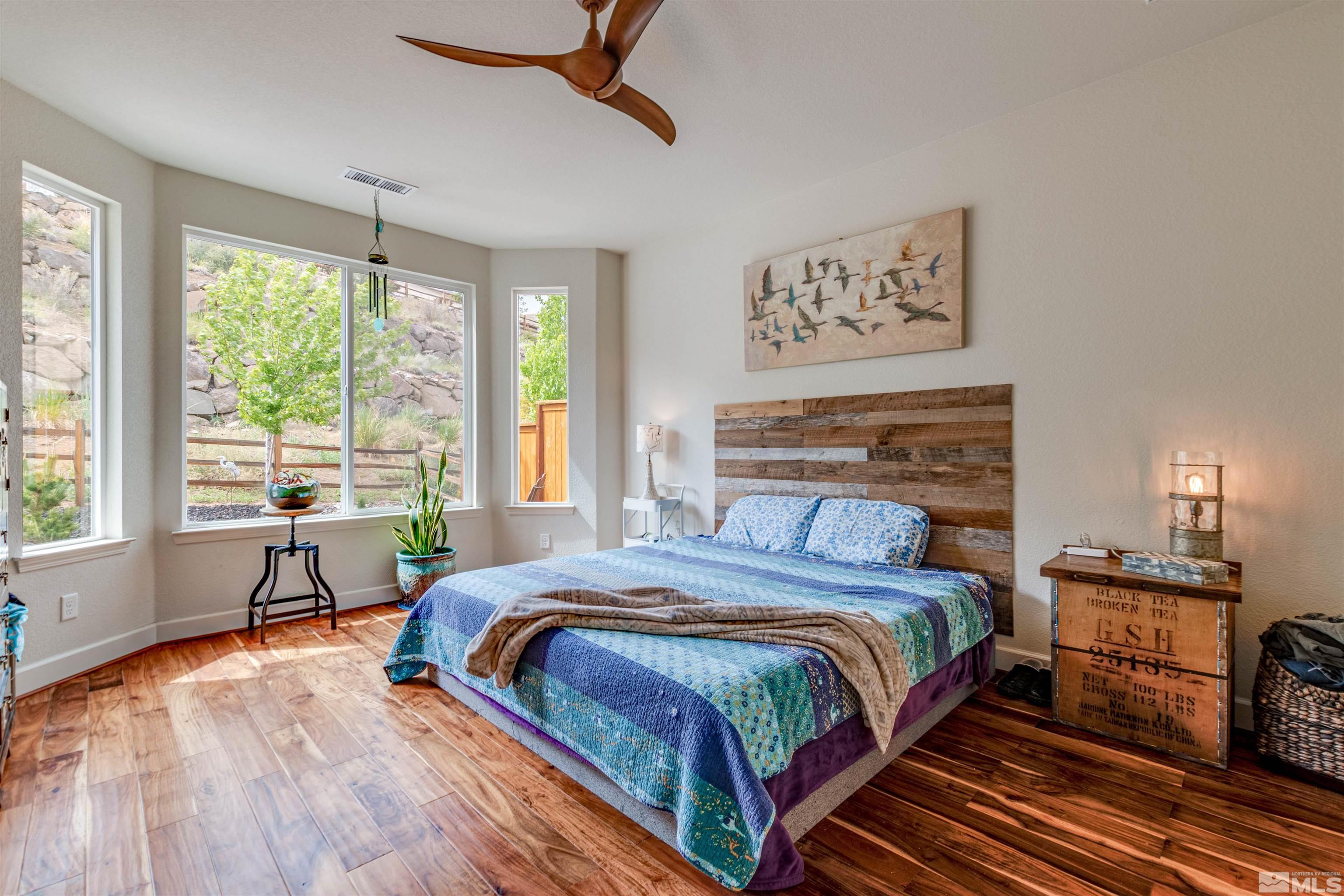 1180 Wakefield Trail Reno, NV 89523 - Photo 13 of 21 a bedroom with a bed and a large window