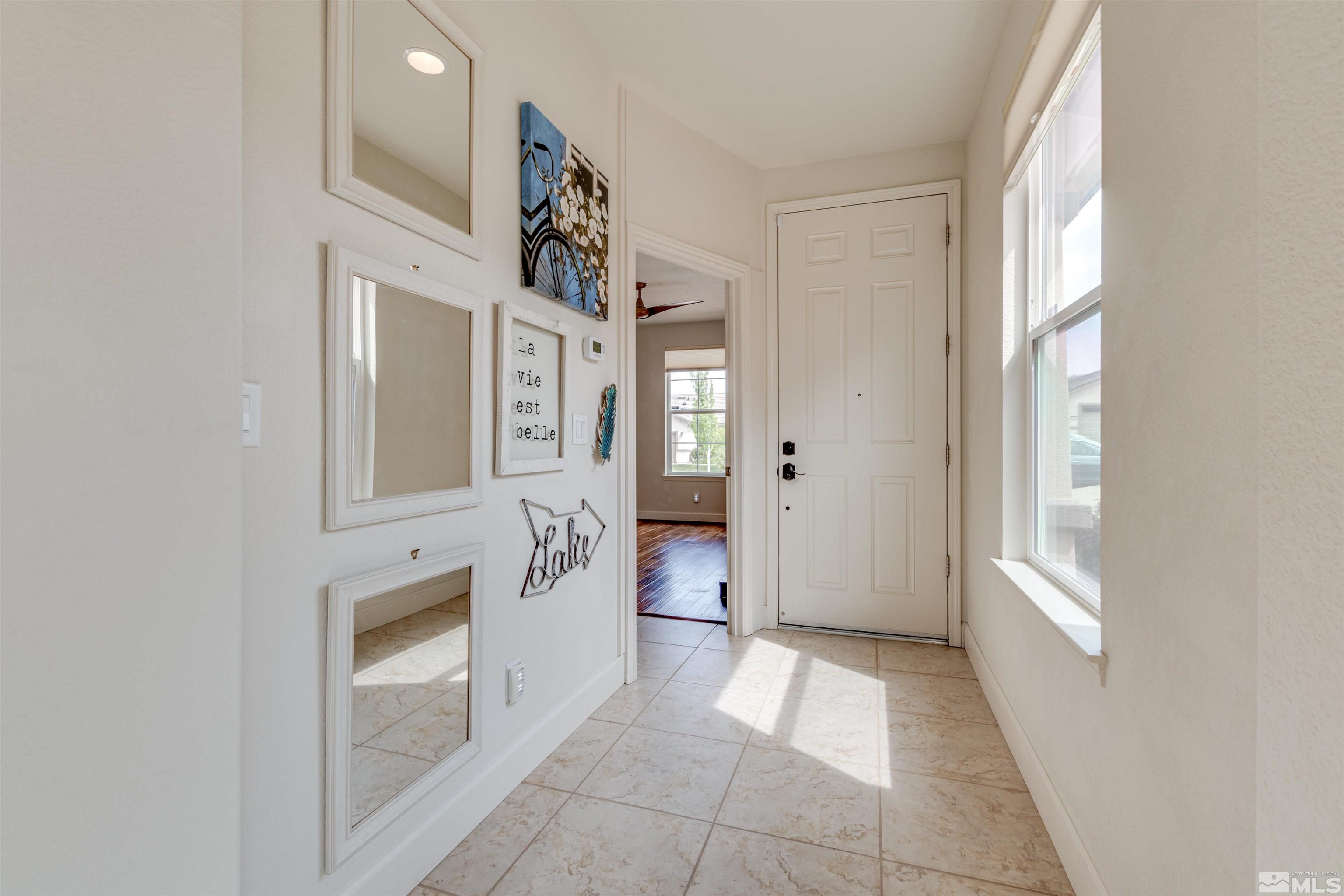 1180 Wakefield Trail Reno, NV 89523 - Photo 3 of 21 a view of a hallway with front door