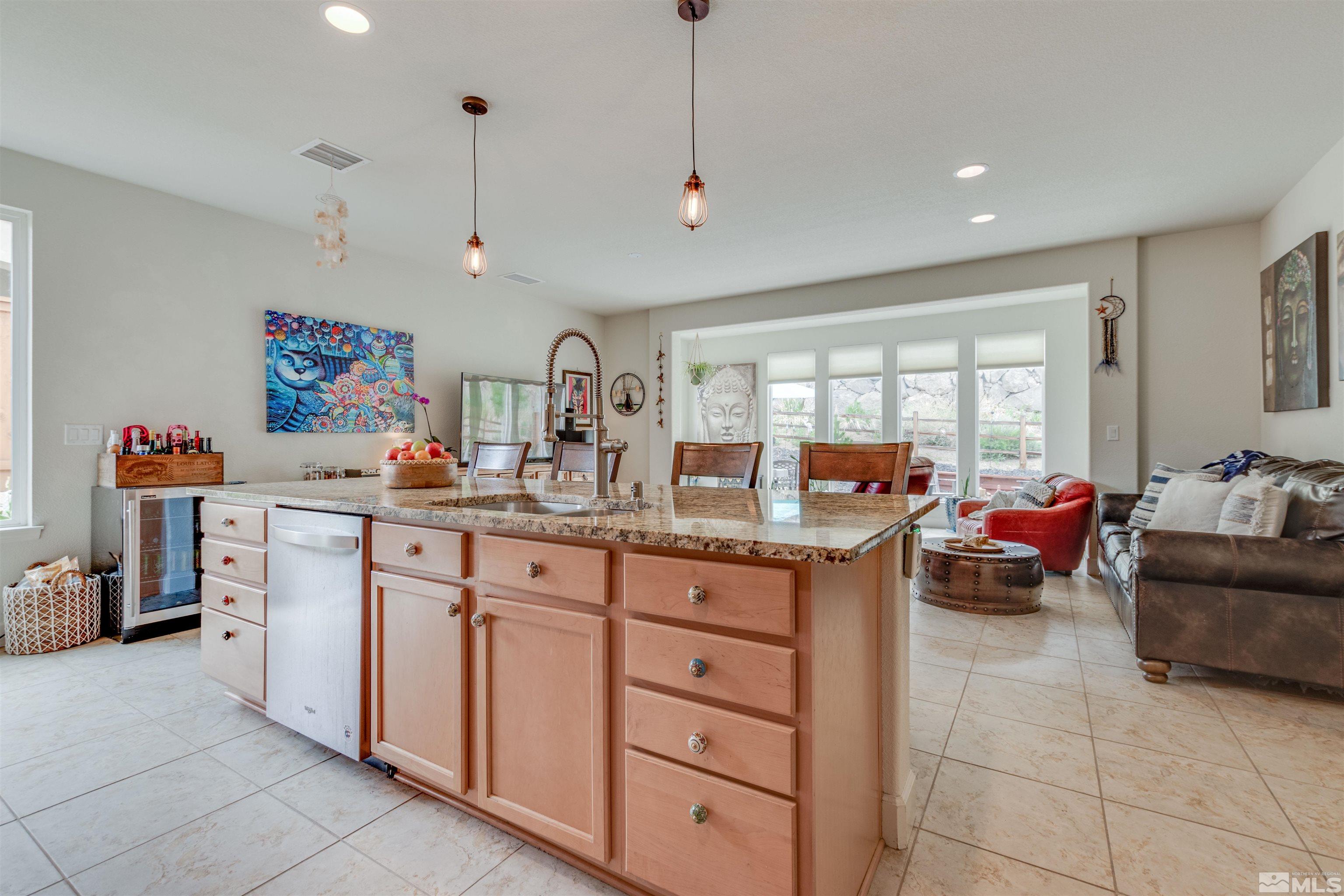 1180 Wakefield Trail Reno, NV 89523 - Photo 6 of 21 a open kitchen with stainless steel appliances granite countertop a refrigerator and a sink