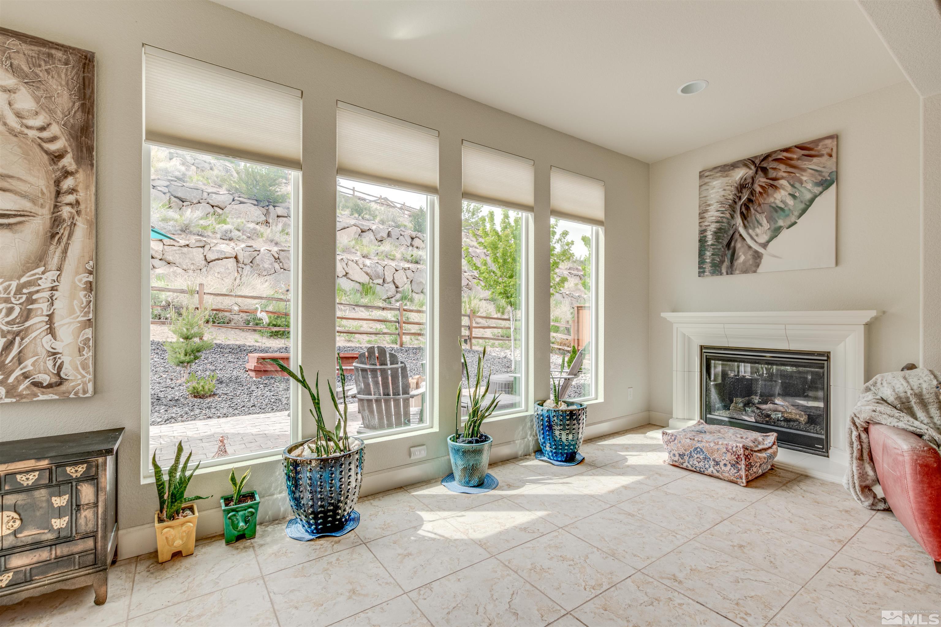 1180 Wakefield Trail Reno, NV 89523 - Photo 10 of 21 a living room with furniture and a fireplace