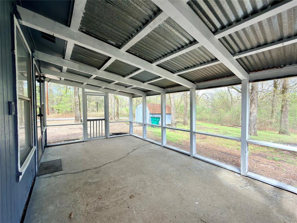 170 Granada Street Payne Springs, TX 75156 - Photo 15 of 20 a view of an empty room with a sliding door