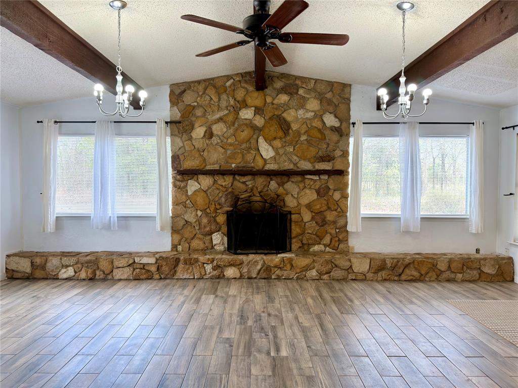 170 Granada Street Payne Springs, TX 75156 - Photo 5 of 20 a view of fireplace and wooden floor