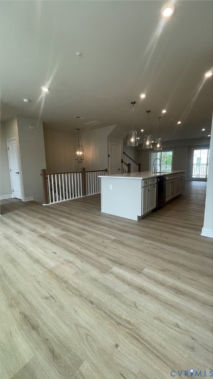 2860 Calgary Lane Chester, VA 23831 - Photo 5 of 16 a view of a room with kitchen island stainless steel appliances wooden floor and window