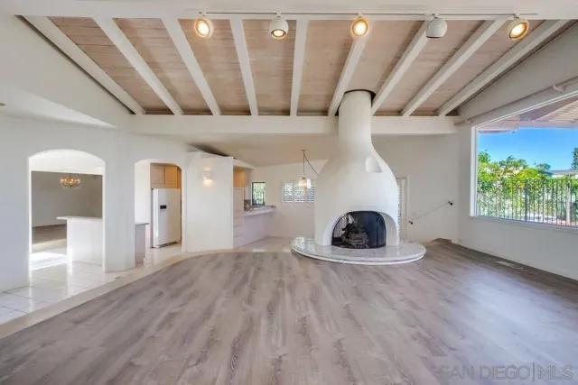 a view of a kitchen with granite countertop cabinets and a wooden floor