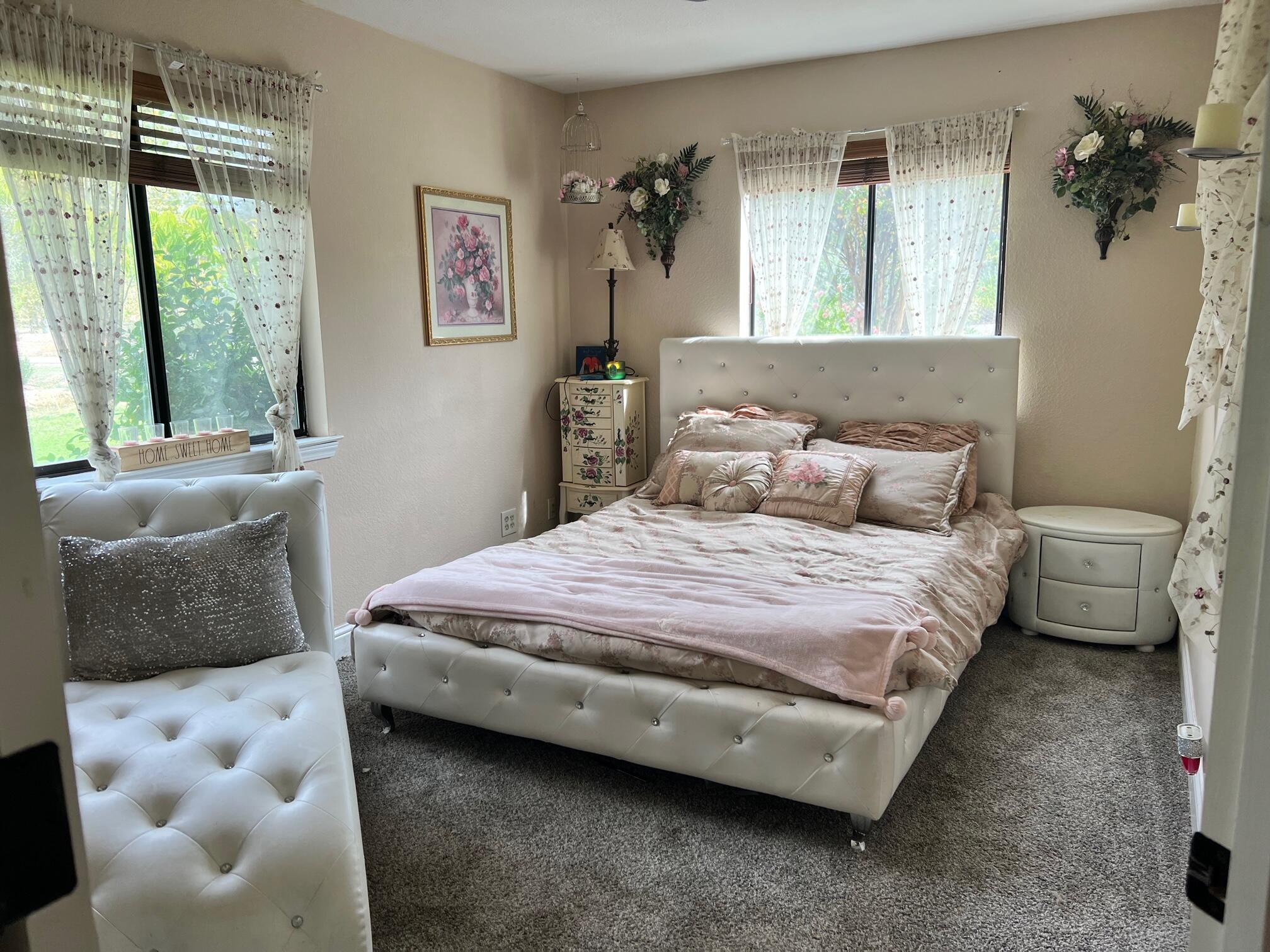 12124 Intermountain Road Redding, CA 96003 - Photo 27 of 43 a bedroom with a bed and a couch