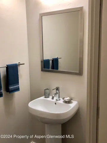 a view of a bathroom from a corridor