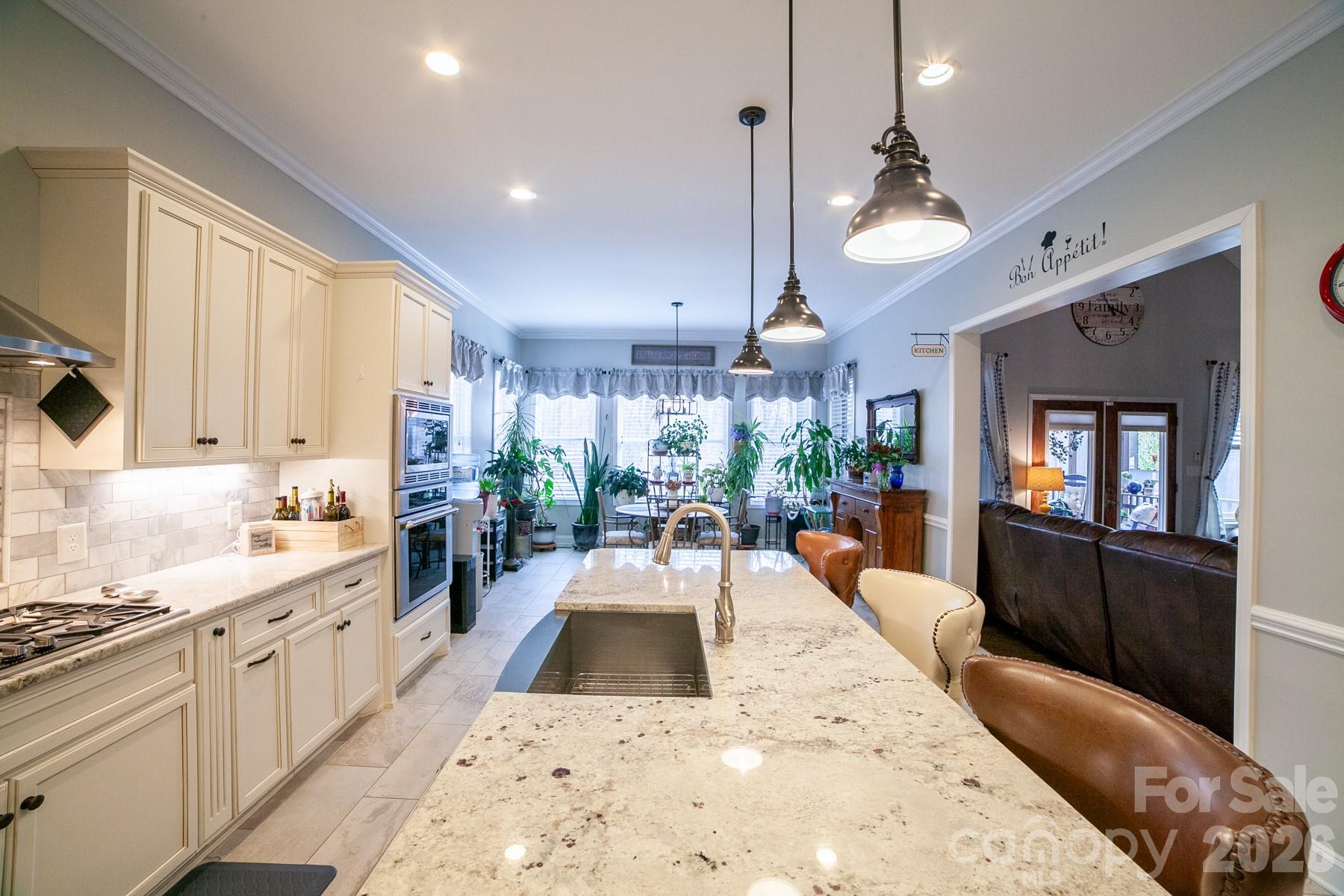 790 Brandon Road Clover, SC 29710 - Photo 22 of 48 a large kitchen with kitchen island a large counter space a sink stainless steel appliances and cabinets