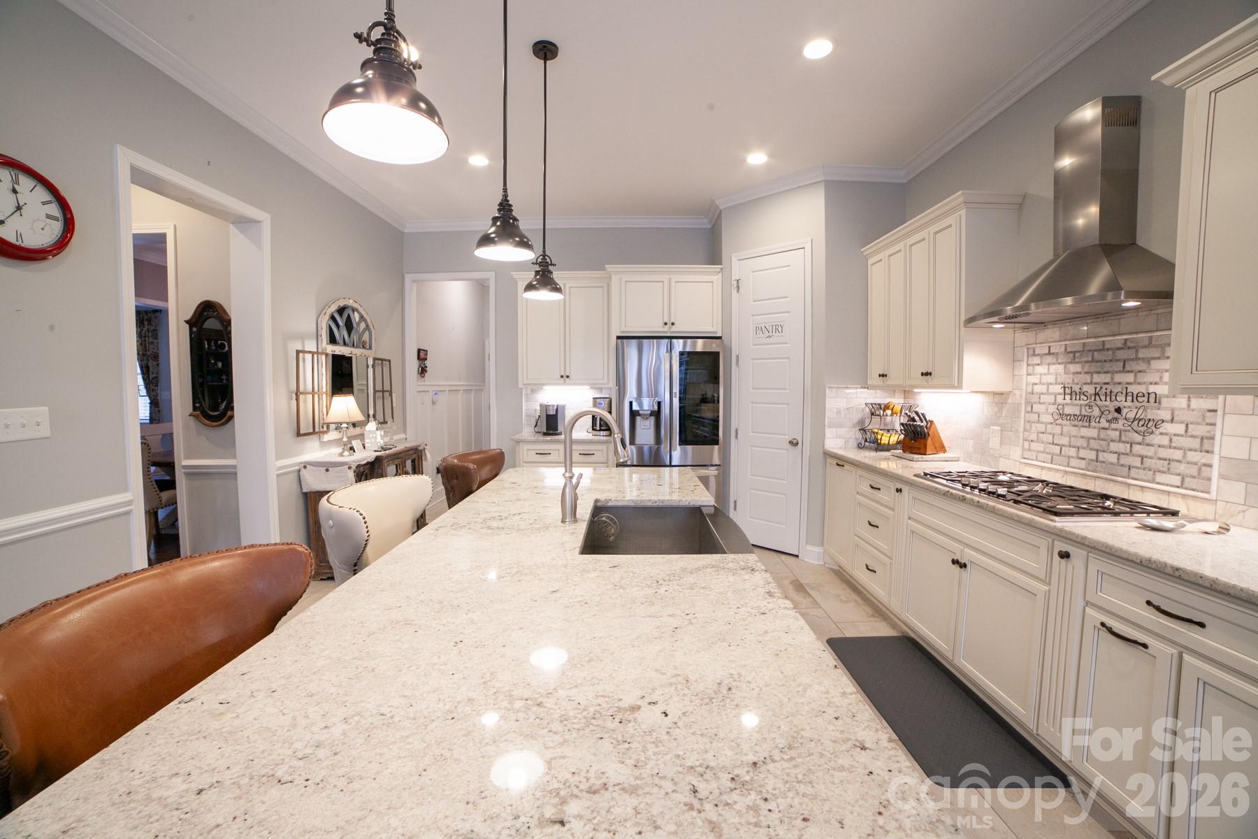 790 Brandon Road Clover, SC 29710 - Photo 24 of 48 a large kitchen with kitchen island a large counter space a sink stainless steel appliances and cabinets
