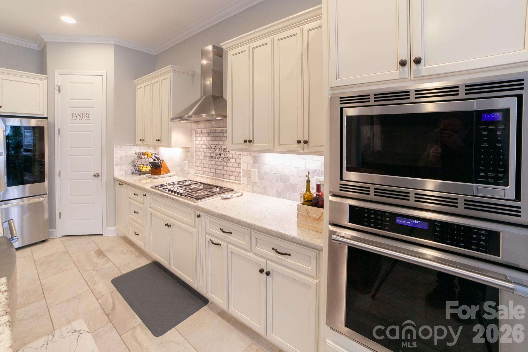 790 Brandon Road Clover, SC 29710 - Photo 25 of 48 a kitchen with stainless steel appliances a stove a microwave and cabinets