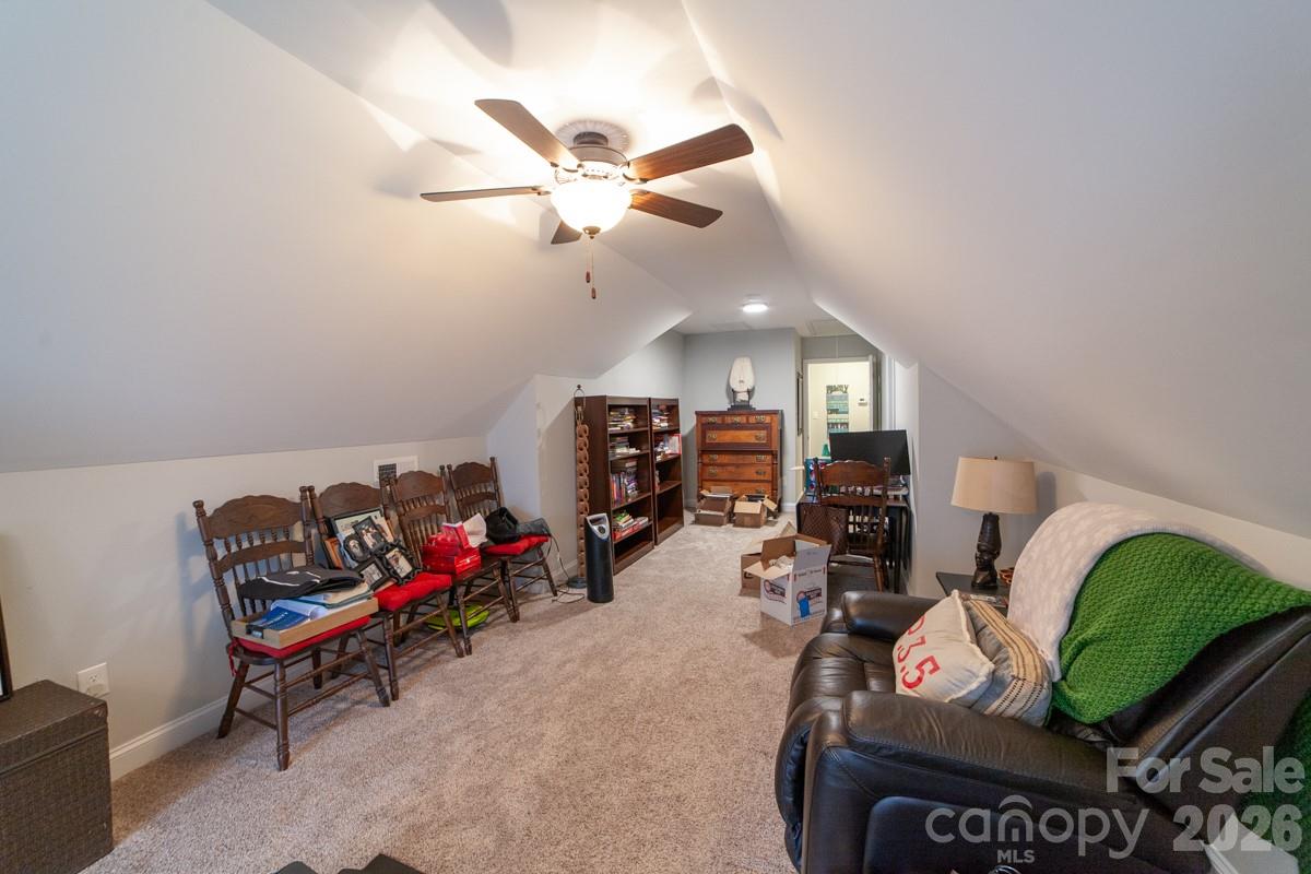 790 Brandon Road Clover, SC 29710 - Photo 32 of 48 a living room with furniture gym equipment and a chandelier