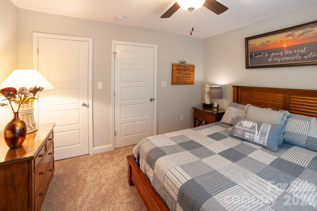 790 Brandon Road Clover, SC 29710 - Photo 36 of 48 a bedroom with a bed and a chandelier