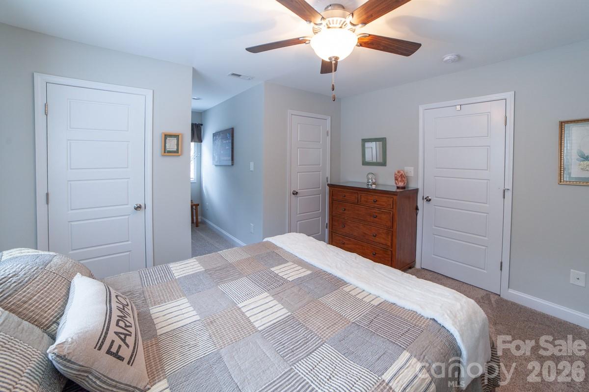 790 Brandon Road Clover, SC 29710 - Photo 48 of 48 a bedroom with a bed and a chandelier